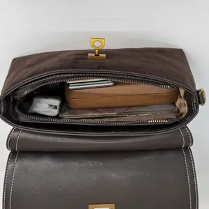 Retro matte brown crossbody bag showing spacious interior compartment and stylish stitching
