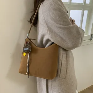 Brown suede hobo shoulder bag with heart and smiley face charms for women