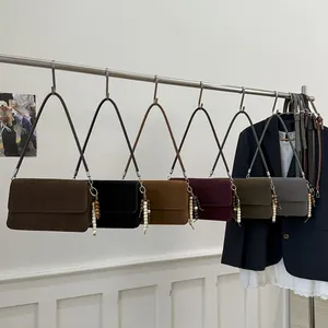 Retro suede crossbody bags in multiple colors with artistic beaded charm and flap design