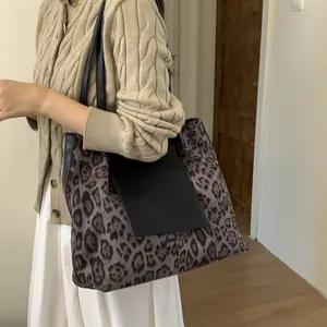 Chic leopard print large tote bag with black leather patchwork and shoulder straps