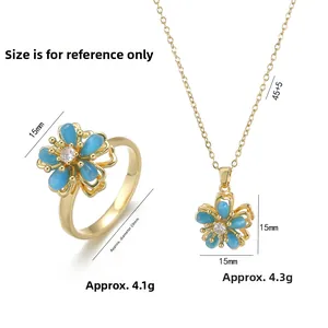 Détails d'une parure de bijoux fleur bleue avec placage doré et dimensions précises