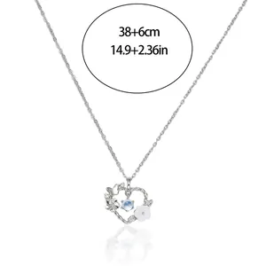Detail view of heart pendant necklace with flower and butterfly motifs and size markings