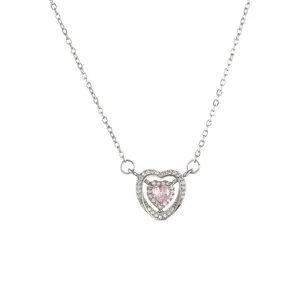 Minimalist silver double heart necklace with pink gemstone and pavé stones