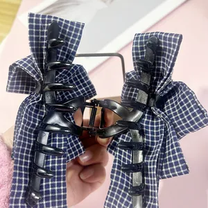 Classic dark blue checkered fabric bow hair claw clip with glossy black finish