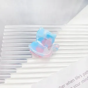 Detailed macro view of a pink and blue marble acetate cat-shaped hair claw clip