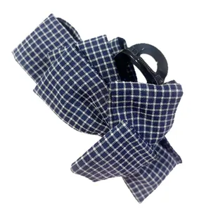 Blue and white plaid bow hair claw clip with tiered fabric design for women