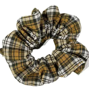 Elegant plaid fabric hair scrunchie with yellow and black check pattern for women