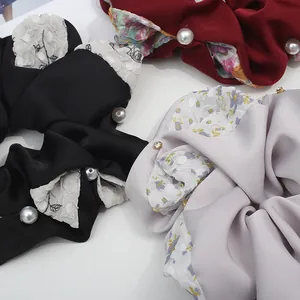 Three-piece set of elegant floral scrunchies with pearls and satin fabric