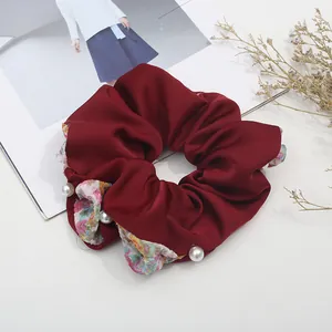 Elegant burgundy satin scrunchie with floral accents and white pearl beads decoration
