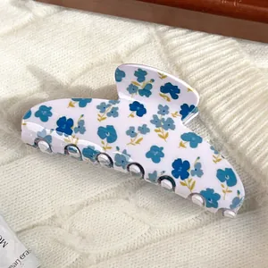 Floral print hair claw clip in beige and blue featuring cute pattern for women