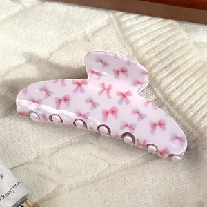 Sweet light pink large hair claw clip with dark pink bow pattern print for women
