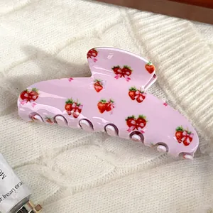 Pink large hair claw clip featuring sweet red strawberry and pink bow floral patterns