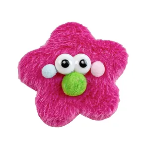 Chouchou étoile en peluche fuchsia avec grands yeux rigolos et détails colorés