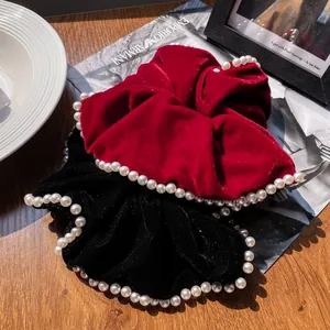 Two-piece vintage velvet scrunchies in red and black with white pearl trimmings