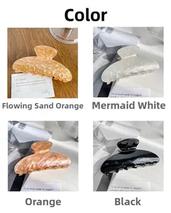 Detailed grid view of large acrylic hair claws in pearlized marble and jelly colors