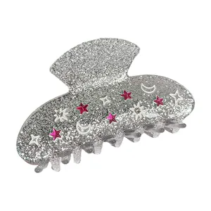 Sparkling silver hair claw clip with pink star and moon patterns for elegant styling