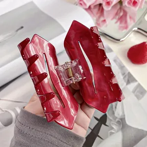 Elegant red acetate heart hair claw with marble texture and premium metal spring mechanism