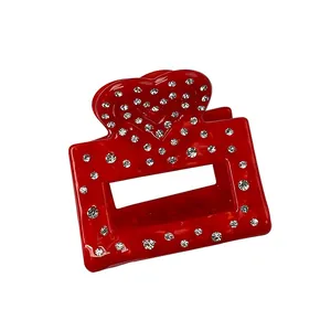 Elegant red heart-shaped acetate claw clip with sparkling rhinestones for hair styling