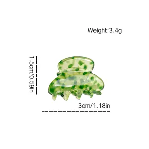 Petite pince à cheveux en acétate avec motif tacheté vert et mesures de taille