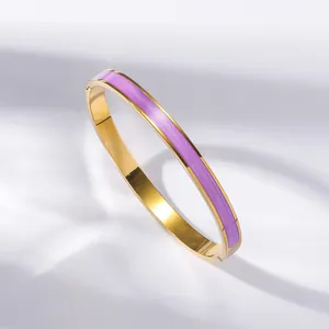 Gold-plated stainless steel hollow Roman numeral bangle with purple enamel and diamonds