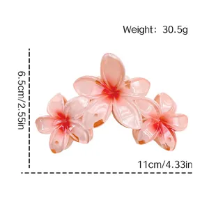 Pince à cheveux fleur de frangipanier rose pesant 30,5 g et mesurant 11 cm de large