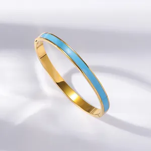 Roman numeral cutout bangle in golden finish with sky blue enamel inlay for women