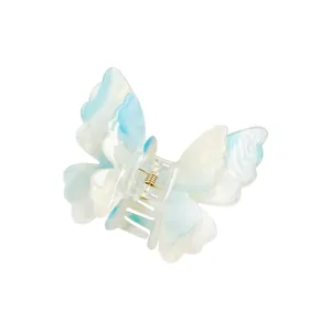 Elegant double-layered butterfly hair claw with blue and white marble texture and gold spring