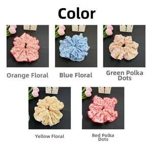 Detail view of floral and polka dot scrunchies in orange, blue, green, yellow and red