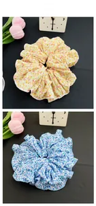 Detailed tile display of floral print scrunchies in yellow and blue colors