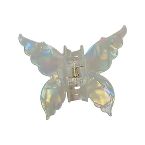 Pinza per capelli a farfalla iridescente con finitura perlata e molla in metallo dorato