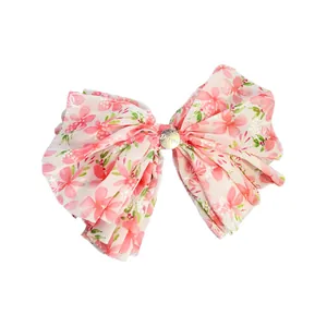 Fermaglio per capelli a fiocco floreale in chiffon con inserto in metallo dorato