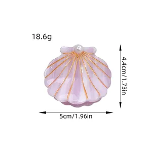 Lavender acetate shell hair claw with pearl accent and gold lines for summer vacation