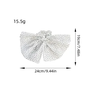 Floral bow hair scrunchie with black stars pattern and 24cm width measurement