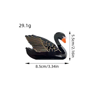 Elegant black swan acetate hair claw clip with gold accents measuring 8.5cm in length