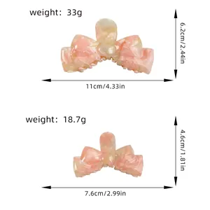 Pink marble acetate bow claw clip set in two sizes for elegant hair styling