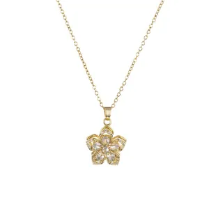 Elegant gold necklace featuring a rotating flower pendant with sparkling cubic zirconia crystals
