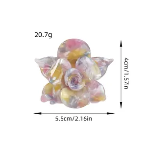 Pince à cheveux fleur en acétate avec texture marbrée rose et jaune 5,5 cm