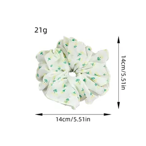 Chiffon-Haargummi mit Blumenmuster in Gelb und Abmessungen von 14 cm Durchmesser