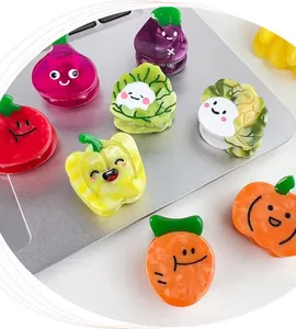 Close-up of colorful acetate vegetable hair clips with cute Q-version cartoon faces