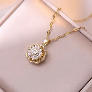 Golden sunflower necklace featuring sparkling white zircon stones on a champagne gift box