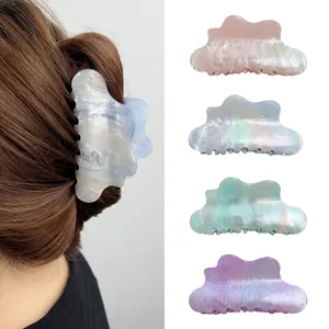Cloud-shaped acrylic hair claws in pearlescent pastel colors for elegant hair styling