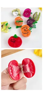 Detailed view of colorful fruit and vegetable acetate hair clips with cute faces