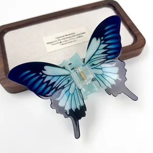 Elegant gradient blue acrylic butterfly hair claw clip with golden metal spring for women