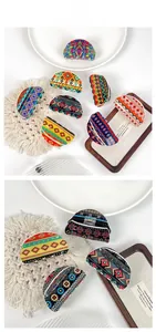 Detail display of bohemian acrylic hair claws with vibrant ethnic geometric patterns