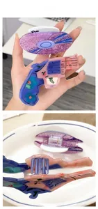Detail showing creative pistol-shaped acetate hair claw and purple glitter clip set