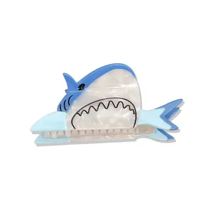 Blue shark hair claw clip made of acetate with pearlescent finish and cute cartoon design