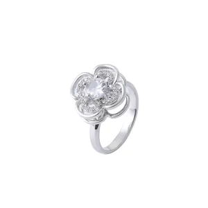 Silver flower ring featuring a sparkling micro-pave zircon center on white background
