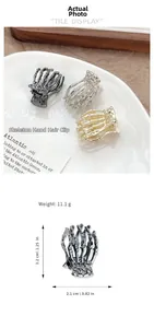 Skull hand hair claw clip in metal finishes with dimensions 3.2cm by 2.1cm