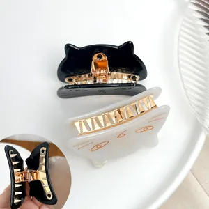 Chic cat shaped hair claw clips in black and pearl white with strong metal spring teeth