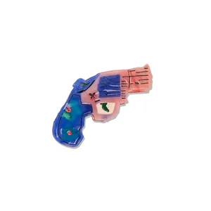 Unique marble texture acetate hair claw clip in a playful handgun shape with blue and pink hues